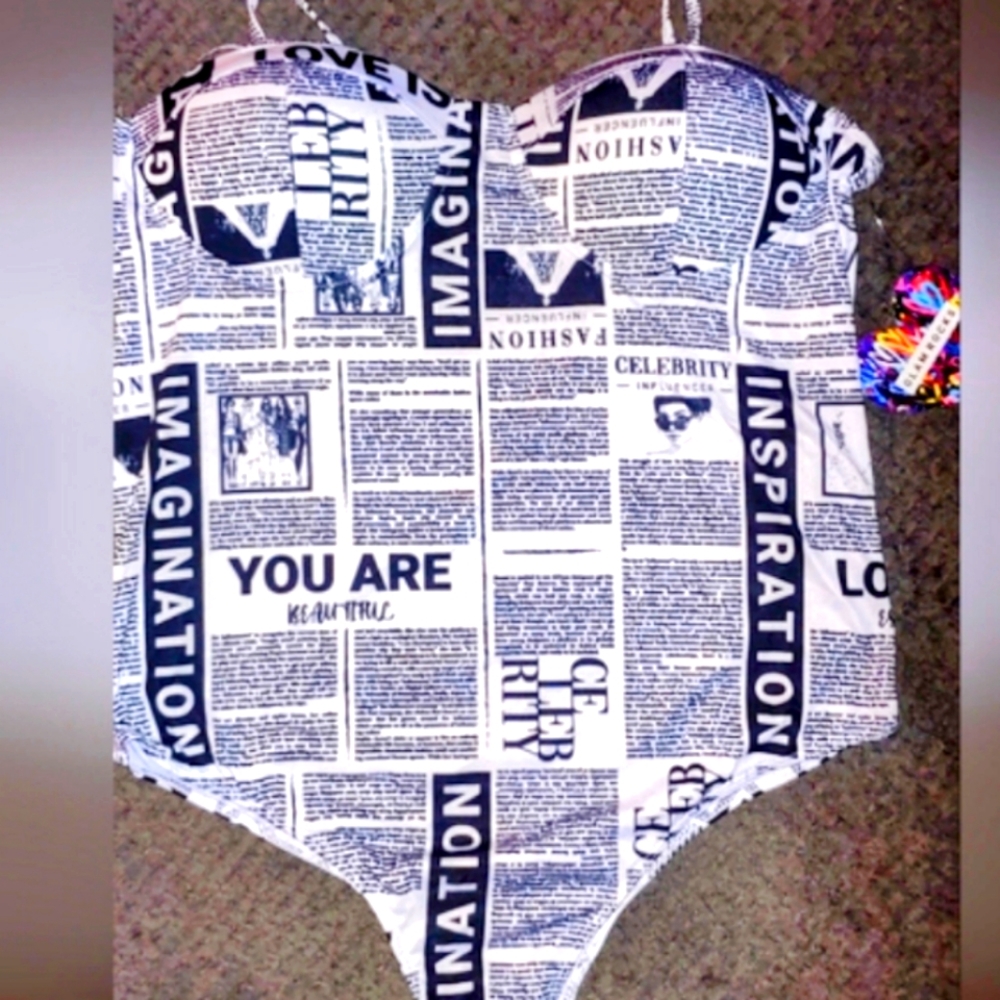 Glam Rocks newsprint push up bodysuit with snap bottom. Size Large